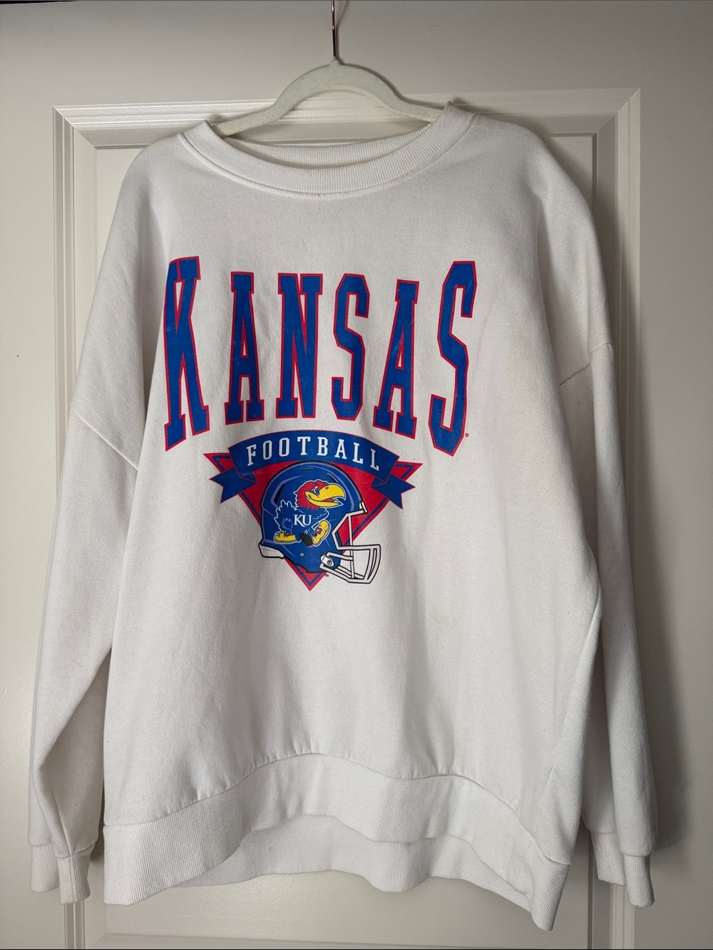 Kansas White Crewneck Sweatshirt with Football Graphic